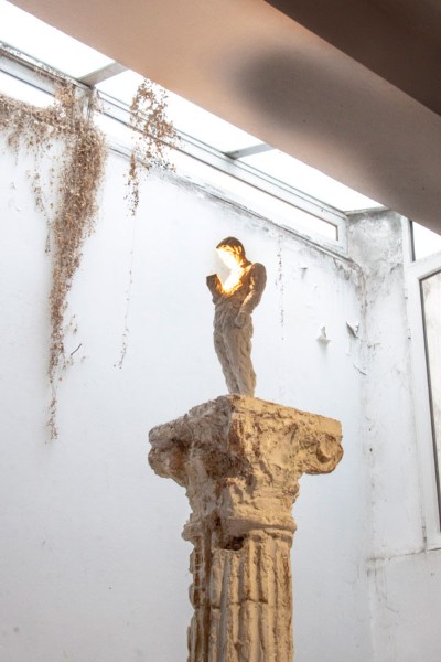 Man Standing, on a Column